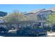 Apartment complex parking area with covered spaces and well-maintained landscaping at 7255 W Sunset Rd # 2093, Las Vegas, NV 89113