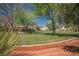 Beautiful community green space with mature trees, landscaping, and walking paths at 7624 Molfetta St, Las Vegas, NV 89149