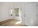 Bright entryway with wood flooring, white walls, and lots of natural light at 7624 Molfetta St, Las Vegas, NV 89149