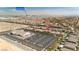 Scenic aerial shot of a community near the Las Vegas Strip, featuring rooftops, desert landscape, and infrastructure at 7837 Hamilton Pool Dr, Las Vegas, NV 89113