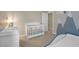 Charming Bedroom featuring a cozy crib and a serene mountain-themed mural at 7837 Hamilton Pool Dr, Las Vegas, NV 89113