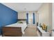 Comfortable bedroom with a twin bed, Marvel decor, and a bright blue accent wall at 7837 Hamilton Pool Dr, Las Vegas, NV 89113