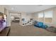 Spacious bonus room with carpeted floors and ample natural light, perfect for playroom at 7837 Hamilton Pool Dr, Las Vegas, NV 89113