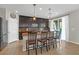 Well-lit kitchen with a large island, granite countertops, and stainless steel appliances at 7837 Hamilton Pool Dr, Las Vegas, NV 89113