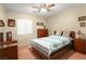 Comfortable bedroom with a ceiling fan, complemented by ample natural light for a serene atmosphere at 7913 Rushmore Ave, Las Vegas, NV 89131