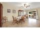 Cozy dining area with tile floors, a decorative cabinet, and bright natural light at 7913 Rushmore Ave, Las Vegas, NV 89131