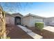 Charming single-story home with a neutral color scheme, well-maintained landscaping, and an attached two-car garage at 7913 Rushmore Ave, Las Vegas, NV 89131