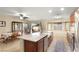 Open kitchen with a large island, stainless steel appliances, and an adjacent dining area at 7913 Rushmore Ave, Las Vegas, NV 89131