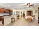 Open-concept kitchen features granite counters, stainless steel appliances, and a central island with seating at 7913 Rushmore Ave, Las Vegas, NV 89131