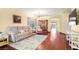 Comfortable living room with hardwood floors and lots of natural light and an adjacent dining area at 7913 Rushmore Ave, Las Vegas, NV 89131