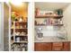 Organized pantry with shelving and counter space for kitchen storage and meal prep at 7913 Rushmore Ave, Las Vegas, NV 89131