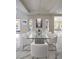 Elegant dining room with glass table and seating for eight; open floorplan at 80 Glade Hollow Dr, Las Vegas, NV 89135