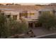 Luxurious home with modern design, multiple windows, and desert landscaping at 80 Glade Hollow Dr, Las Vegas, NV 89135