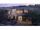 Modern home featuring a multi-car garage and unique architectural design at 80 Glade Hollow Dr, Las Vegas, NV 89135