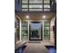 Inviting front entrance with a modern door, sleek sidelights, and minimalist concrete walkway over a water feature at 80 Glade Hollow Dr, Las Vegas, NV 89135