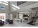 Spacious great room featuring high ceilings, tile floors, and stairs to the second level at 80 Glade Hollow Dr, Las Vegas, NV 89135