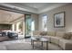 Bright living room with sliding glass doors to an outdoor patio and stylish contemporary furniture at 80 Glade Hollow Dr, Las Vegas, NV 89135