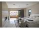 Bright main bedroom with private balcony, contemporary furnishings, and views at 80 Glade Hollow Dr, Las Vegas, NV 89135