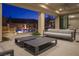Stylish outdoor living space with comfortable seating, fire features, and a pool view perfect for relaxation at 80 Glade Hollow Dr, Las Vegas, NV 89135