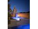 Modern pool featuring a waterfall, fire feature, and desert landscaping at 80 Glade Hollow Dr, Las Vegas, NV 89135