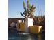 Stylish water feature with cascading waterfall and desert plants, adding a touch of elegance to the outdoor space at 80 Glade Hollow Dr, Las Vegas, NV 89135