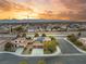 Stunning aerial view of a home with solar panels, nestled in a well-maintained neighborhood with mountain views at 8115 Cowboy Springs St, North Las Vegas, NV 89085