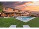 Stunning backyard with a sparkling pool, lounge chairs, and covered patio for outdoor enjoyment at 8115 Cowboy Springs St, North Las Vegas, NV 89085