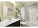 Neutral bathroom with a single sink vanity and bathtub shower combo, offering practical comfort at 8115 Cowboy Springs St, North Las Vegas, NV 89085