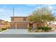 Charming two-story home featuring a three-car garage and well-maintained landscaping at 8115 Cowboy Springs St, North Las Vegas, NV 89085