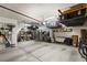 This organized garage features storage shelves and space for multiple vehicles at 8115 Cowboy Springs St, North Las Vegas, NV 89085