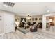 Spacious living room with modern floors, comfortable seating, and a welcoming layout at 8115 Cowboy Springs St, North Las Vegas, NV 89085