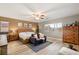 Spacious main bedroom with laminate floors, neutral walls, and ample natural light at 8115 Cowboy Springs St, North Las Vegas, NV 89085