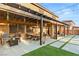 Charming outdoor patio with a pergola, comfortable seating, and stylish decor, perfect for al fresco dining and relaxation at 8115 Cowboy Springs St, North Las Vegas, NV 89085