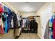 Large walk-in closet with rod and shelf storage for clothes and accessories at 8115 Cowboy Springs St, North Las Vegas, NV 89085
