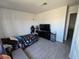 Bedroom featuring a bed, dark wood furnishings, and laminate flooring at 8401 Luna Bay Ln, Las Vegas, NV 89128