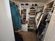 Organized walk-in closet with ample storage space for clothing, shoes, and accessories at 8401 Luna Bay Ln, Las Vegas, NV 89128