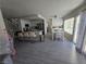 Bright and airy kitchen featuring modern appliances, a breakfast bar, and an adjacent dining area at 8401 Luna Bay Ln, Las Vegas, NV 89128