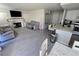 View of open floor plan showing living room with fireplace, dining, and kitchen areas at 8401 Luna Bay Ln, Las Vegas, NV 89128
