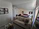 Spacious main bedroom with a seating area, decor, and natural light at 8401 Luna Bay Ln, Las Vegas, NV 89128