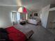 Comfortable main bedroom featuring decor, natural light, and seating area at 8401 Luna Bay Ln, Las Vegas, NV 89128