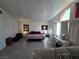 Bright main bedroom featuring decor, comfortable furnishings, and ample natural light at 8401 Luna Bay Ln, Las Vegas, NV 89128