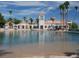 Lagoon pool featuring a tower, beach entrance, and surrounding cabanas offers a resort-style experience at 8401 Luna Bay Ln, Las Vegas, NV 89128