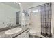 Bathroom featuring a single vanity sink, granite counters, shower, and a tub at 8515 Belcastro St, Las Vegas, NV 89113
