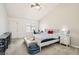 Bright bedroom with a large bed, workstation, and lots of natural light from the window at 8515 Belcastro St, Las Vegas, NV 89113