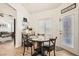 Cozy dining area features a wood table, four chairs, and lots of natural light at 8515 Belcastro St, Las Vegas, NV 89113