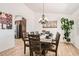 Elegant dining room featuring a large wooden table, chandelier, and decor at 8515 Belcastro St, Las Vegas, NV 89113
