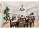 Elegant dining room featuring a large wooden table, chandelier, and decor at 8515 Belcastro St, Las Vegas, NV 89113