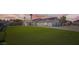 Charming single-story home with well-manicured lawn and solar panels offers sustainable living at 8515 Belcastro St, Las Vegas, NV 89113