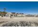 Attractive single-story home with solar panels and an enclosed front yard, surrounded by mature trees at 8515 Belcastro St, Las Vegas, NV 89113