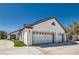 Spacious three-car garage with white doors and ample driveway parking on this property at 8515 Belcastro St, Las Vegas, NV 89113
